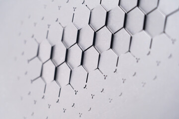 The background of the gray embossed wall texture has a geometric relief pattern