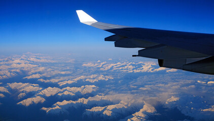 Swiss Alps and Airbus A340 313 wing early morning