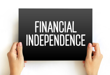 Financial independence - status of having enough income or wealth sufficient to pay one's living expenses for the rest of one's life, text concept on card - 796517930