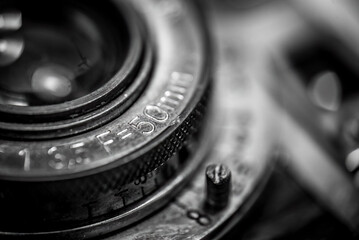 Closeup of an old retro film camera lens - obrazy, fototapety, plakaty