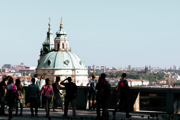 Tourists observe the Prague skyline from atop of the Prague Castle garden. Czech Republic - 796536949