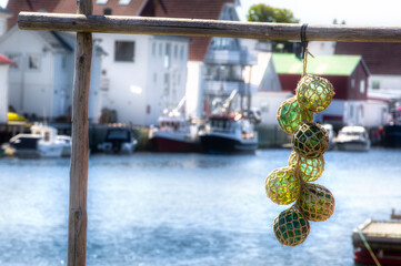 Glass Fishing Floats Decoration on a Rack in Henningsvaer in Lofoten, Norway - obrazy, fototapety, plakaty