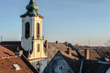 View of Blagovestenska church among old tile roofs. Szentendre, Hungary - 796539111