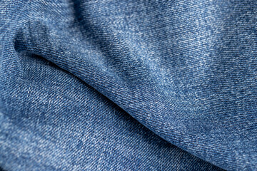Fototapeta premium new denim fabric from clothing jeans close-up
