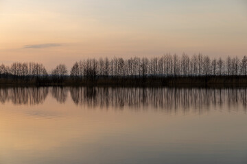 Fototapeta premium reflection of the sky in the lake at sunset