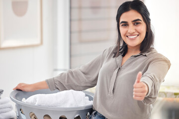 Woman, portrait and laundry basket with thumbs up in house for cleaning, dust and tidy clothes....