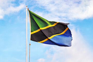 Tanzania flag on sky background. waving flag of Tanzania. Concept of Tanzanian.