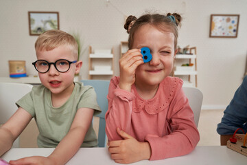 Children having fun in the kindergarten - obrazy, fototapety, plakaty