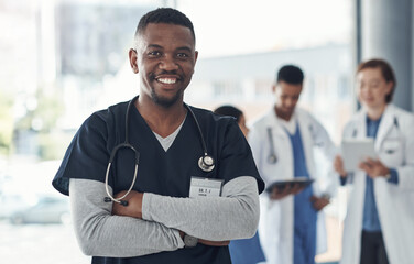 Black man, nurse and arms crossed in hospital or medical meeting with confidence, integrity or about us. Portrait of healthcare doctor in leadership with ADN support, advice or planning in USA clinic