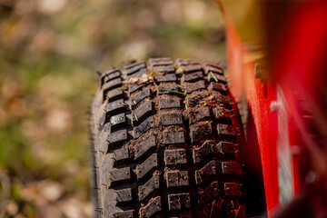 Off-road wide type tires full with mud and dirt riding off road in ground