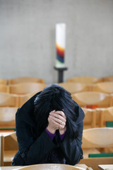 Catholic church. Christian woman praying.