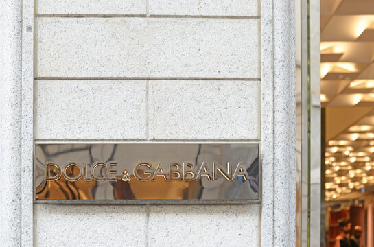 MILAN, ITALY &ndash; APRIL 11, 2024: Detail of the gable with golden logo in Via Monte Napoleone. Dolce & Gabbana is an Italian luxury fashion brand, founded in 1985 in Legnano
