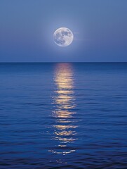 A full moon reflecting on calm waters
