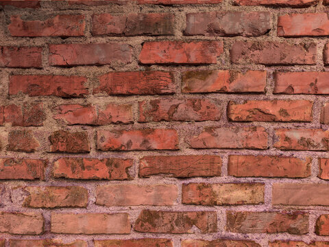 Texture of old dark brown and red brick wall background.