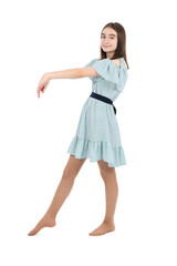 Young beautiful girl in a dress with polka dots on a white background.