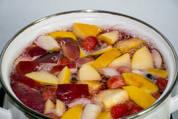 Compote of apples and strawberries. Compote with apples and strawberries. Hot drink. We prepare compote at home. View from above.