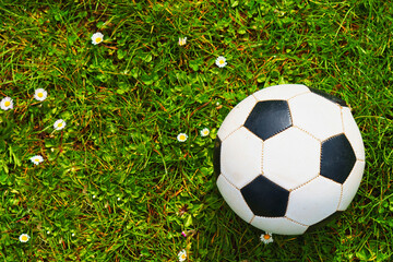 A soccer ball over a green grass field