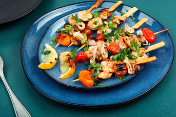 Tasty grilled seafood kebabs, shellfish.