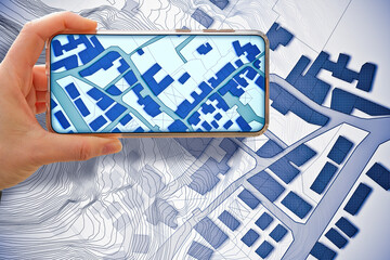 Imaginary cadastral map of territory with buildings and land parcel - concept with smartphone and cityscape