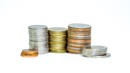 Many Thai baht coins arranged in neat layers on a white background, isolated