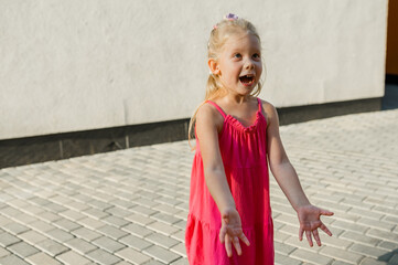 Child girl with hearing aids and cochlear implants having fun outdoor speak and playing. Inclusion and disability. Copy space and empty place for advertising. - 796635787