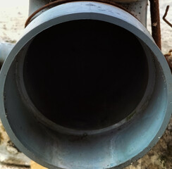 Selective focus. Storm drain - PVC pipe drain.
