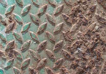 Surface On Old Sheet Of Metal Texture, Cross-embossed to make it less slippery for walking.Metal sheet plate with a rough brown-orange rust, Abstract texture background Used to assemble the background