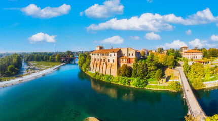 Panoramic aerial view of Adda river, with the castle of Cassano d'Adda town, Lombardy, Italy