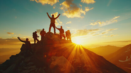 Male hiker celebrating success on top of a mountain in a majestic sunrise and Climbing group friends helping hike up .Teamwork, Helps,Success, winner and Leadership.