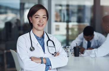 Portrait, woman doctor and hospital for healthcare, physician and medical health staff. Professional, expert and surgeon with stethoscope, female person and cardiologist for research with colleagues