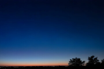 Fototapeta premium Night blue sky with stars. Evening sky on the horizon.