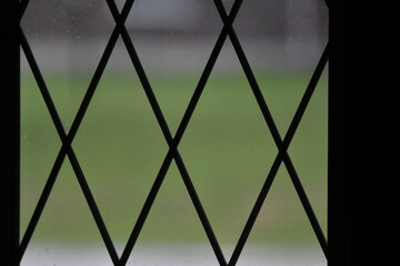 Metal Grid on a Glass Window