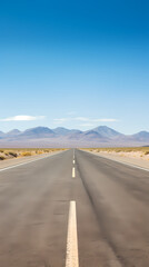 Naklejka premium Highway in the desert, mountains on the horizon
