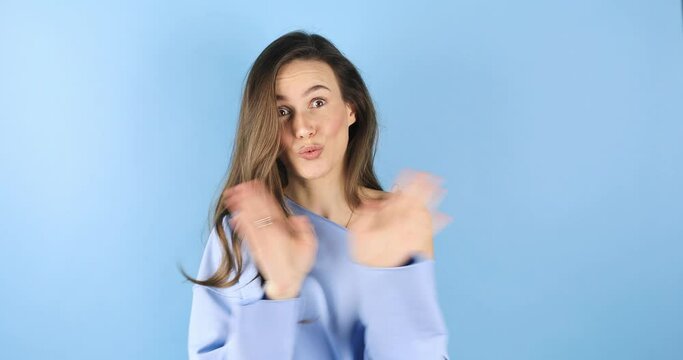 Brunette woman looking camera pointing fingers herself ask me no i do not need it. Girl point on her, waving her hands and say no isolated on blue background.