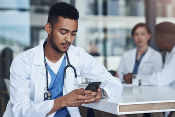 Cellphone, male doctor and hospital for healthcare, physician and telehealth health staff. Texting,...