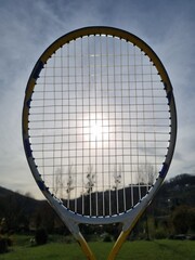 racket, badminton, tennis, sport, ball, game, racquet, shuttlecock, equipment, play, net, leisure, object, activity, sports, court, sky, exercise, recreation, fitness, player, competition, squash, fun