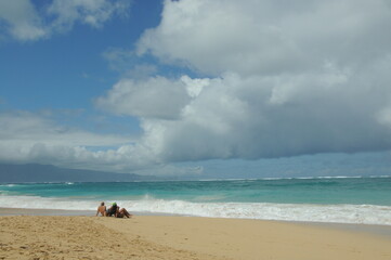 Alone on Baldwin Beach, Maui, Hawaii, billowy clouds, couple on shore, wave action, summer, blue...
