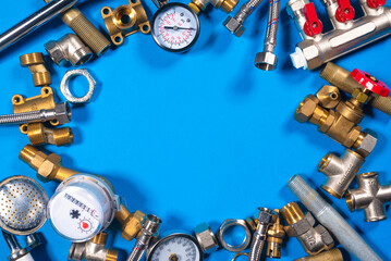 Plumbing water line equipment on the blue flat lay background. Plumbing service with copy space.