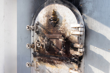 Crematorium door close from cremate funeral human body cremation ceremony of religion buddhist in temple of Thailand. 