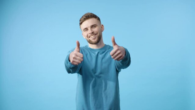 Blooming approval: man in blue shirt giving a thumbs up