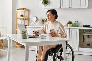 A disabled woman in a wheelchair utilizing a laptop at home in her kitchen for remote work.