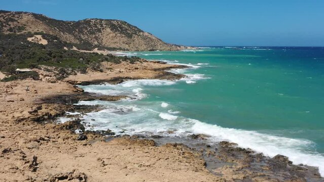 Aerial view of a rocky sandy beach and waves in Greece Gavdos island, Crete