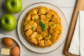Tarte Tatin is a variant of apple pie in which the apples have been caramelized in butter and sugar...