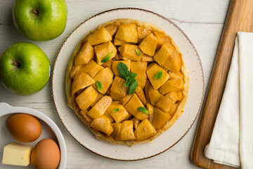 Tarte Tatin is a variant of apple pie in which the apples have been caramelized in butter and sugar before adding the dough.
