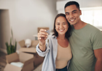 Portrait, couple and happy in new home with keys for moving in, satisfied and confident with ownership. Property, relationship and smile with unpacking furniture, excited and positive with property