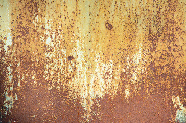 Paint peeling crackling off brown rusty metal texture background. Green paint peeling off rusty...