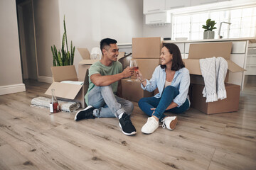 Wine, toast or asian couple in new house floor celebration for moving, real estate and investment...