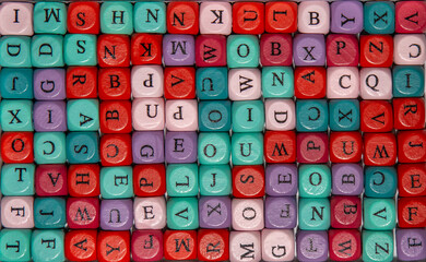 Background with letters on colored cubes