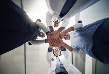 Doctors, circle and below with hands in stack for diversity, support or solidarity in medical...