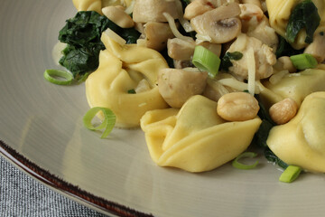 Savory Spinach and Ricotta Stuffed Tortellini in Creamy Chicken and Mushroom Sauce